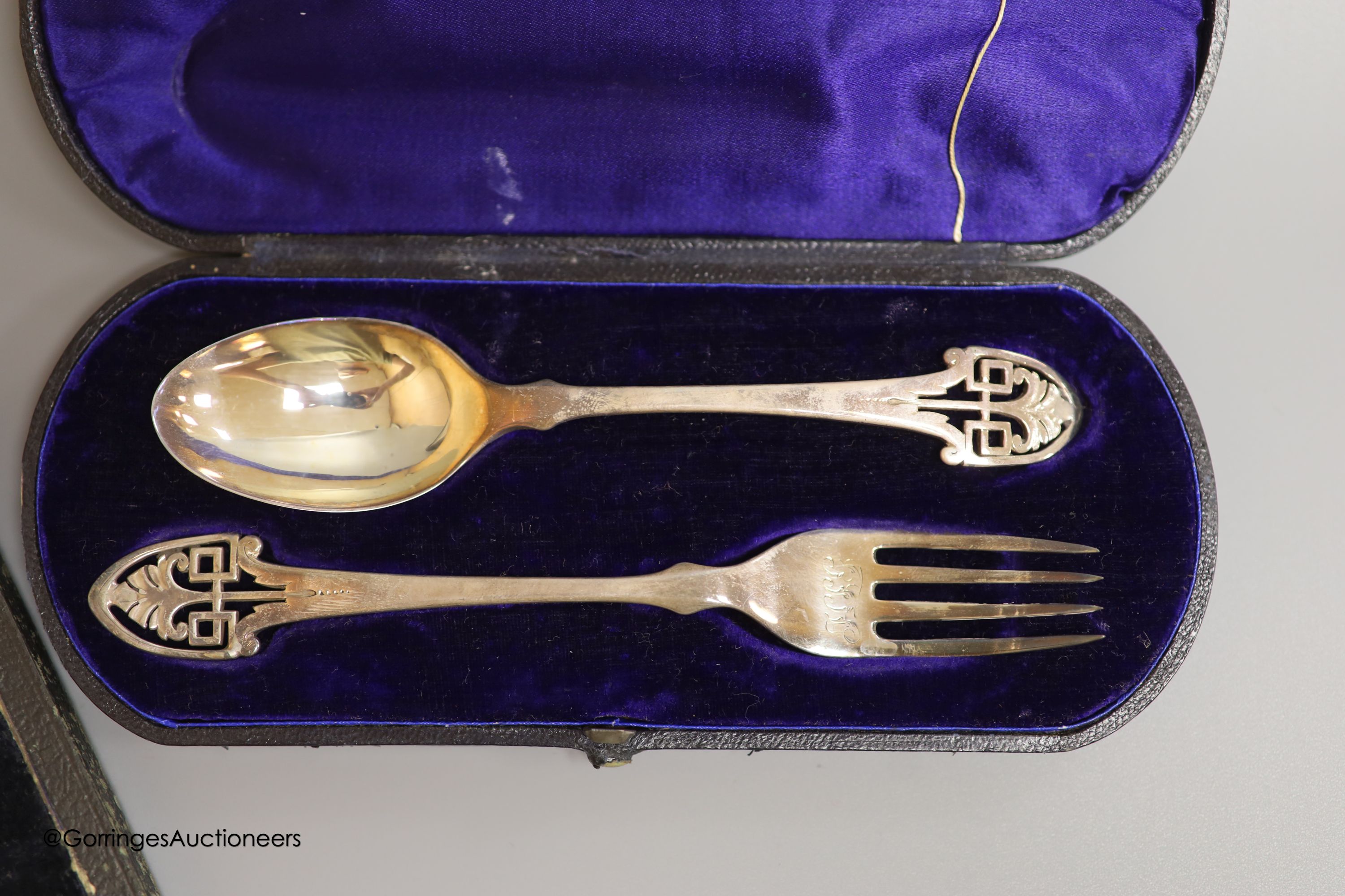 A cased Victorian silver christening spoon and fork, with pierced terminals, Jehoiada Alsop Rhodes, Sheffield, 1873 and a draughtsman's set.
